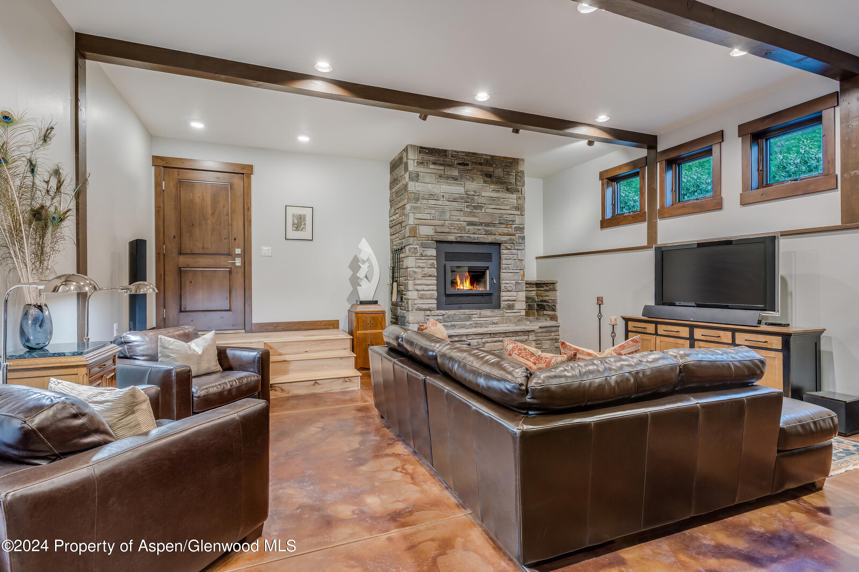 900 Dorais Way Redstone, CO 81623 - Photo 36 of 63 37-stone wood fireplace living room-81_9