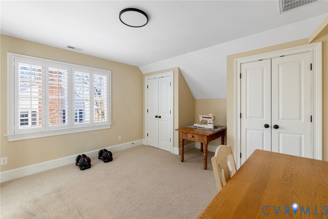 8947 Cherokee Road Richmond, VA 23235 - Photo 37 of 45 a bedroom with a bed and a window