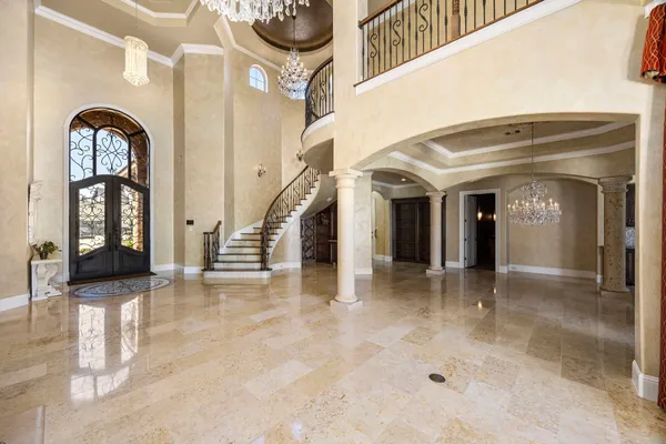 a view of hall way with furniture