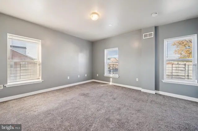 an empty room with windows