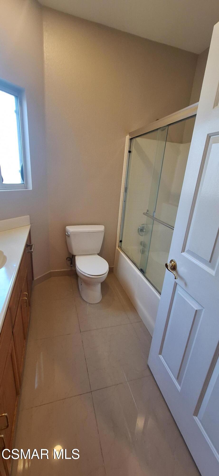 7337 Balboa Boulevard, Unit 5 Van Nuys, CA 91406 - Photo 13 of 13 a bathroom with a sink and a toilet