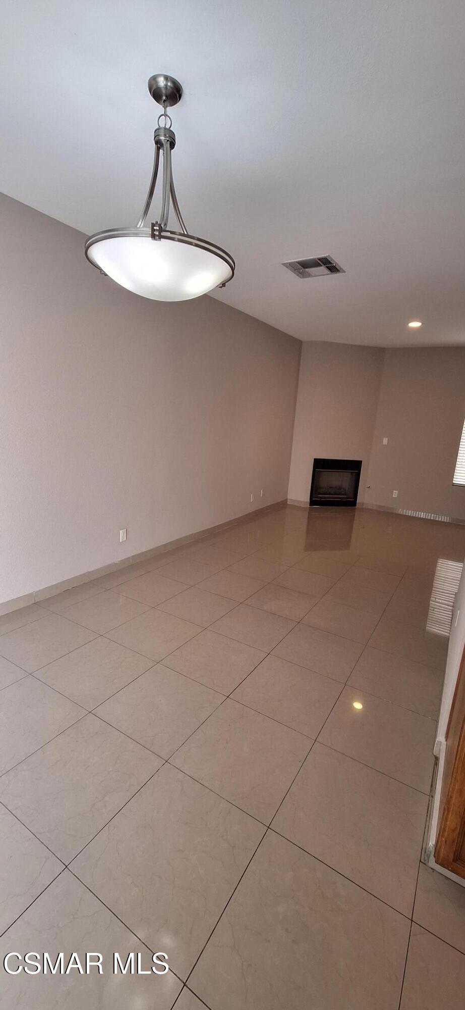 7337 Balboa Boulevard, Unit 5 Van Nuys, CA 91406 - Photo 3 of 13 a view of a room with a sink and chandelier