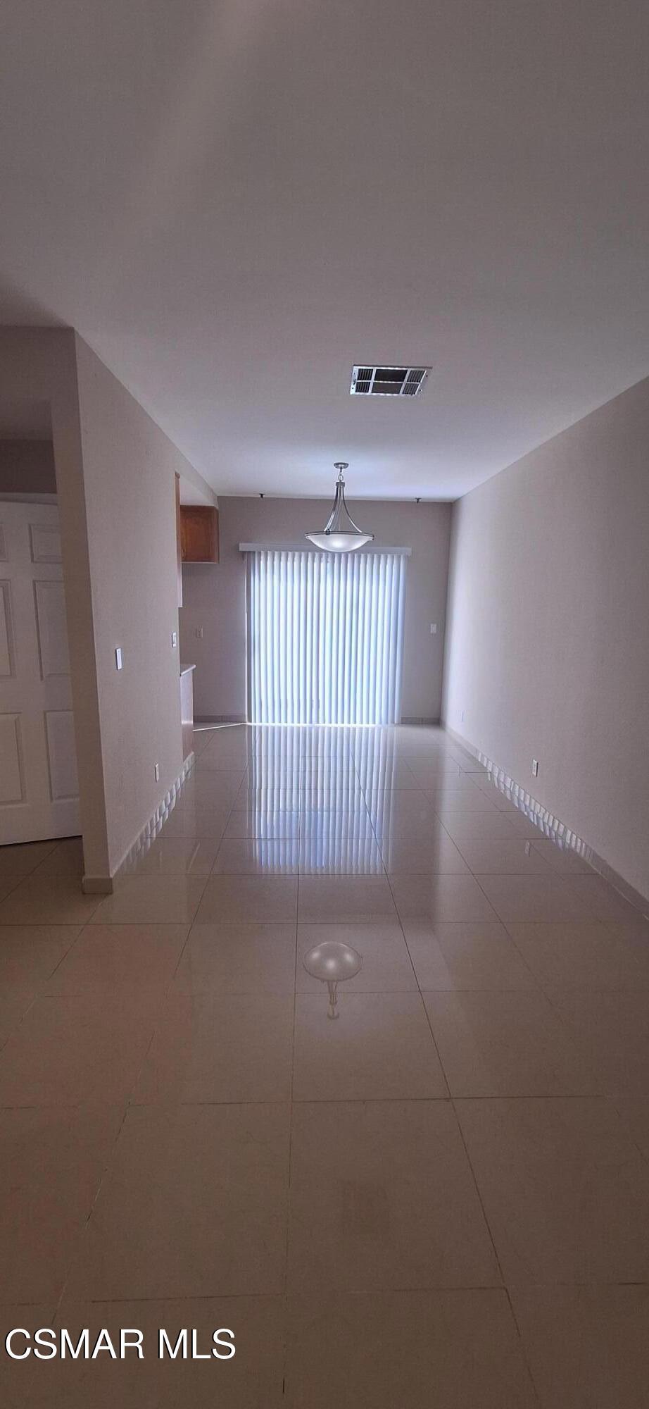 7337 Balboa Boulevard, Unit 5 Van Nuys, CA 91406 - Photo 4 of 13 a view of an empty room with a window