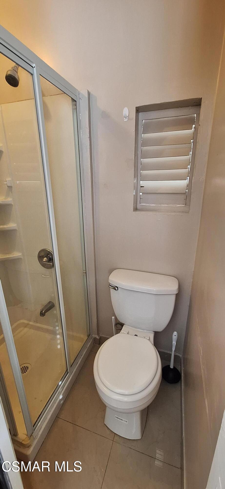 7337 Balboa Boulevard, Unit 5 Van Nuys, CA 91406 - Photo 8 of 13 a bathroom with a toilet and a shower