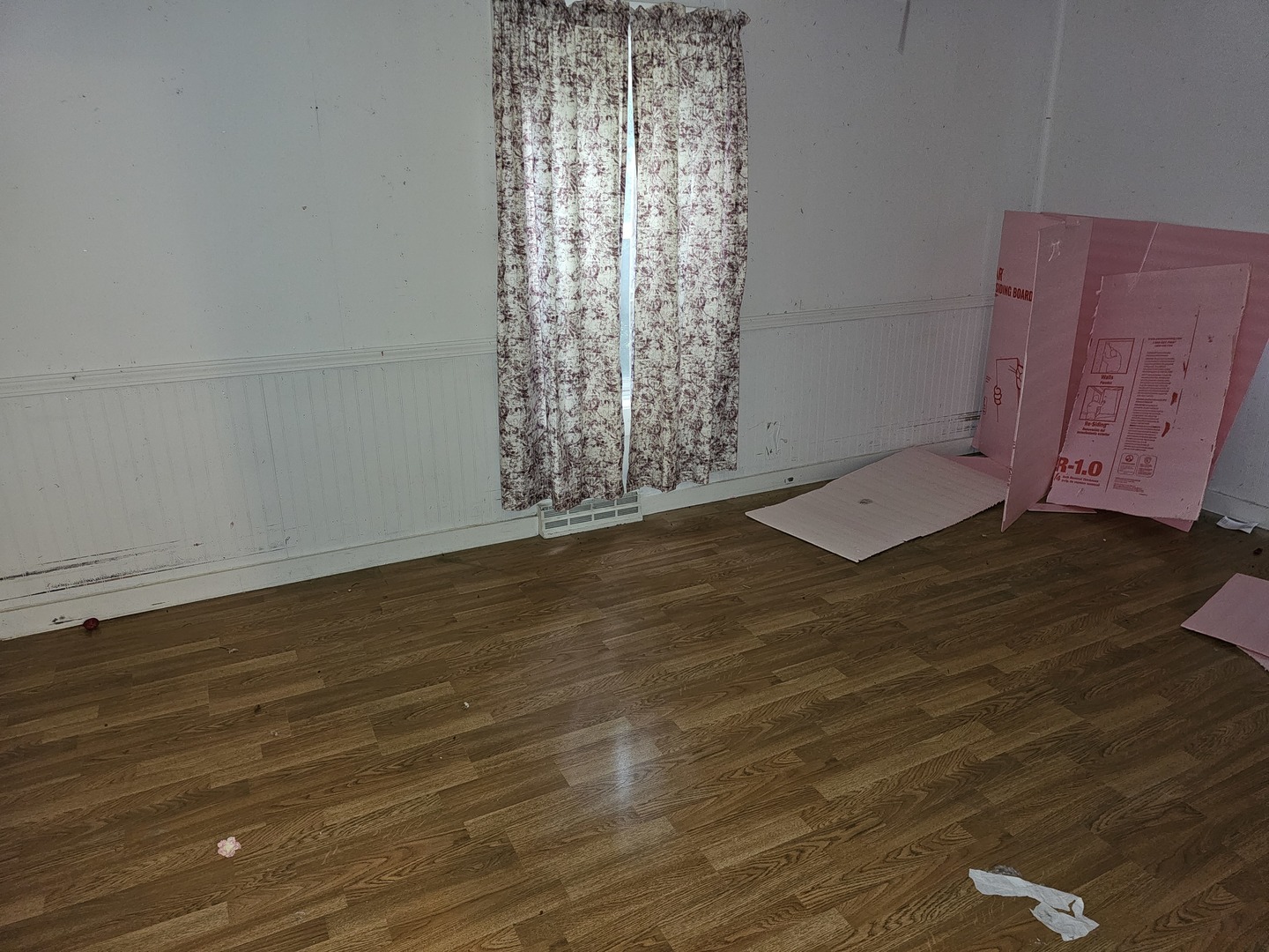 23018 Freeport Road Sterling, IL 61081 - Photo 5 of 19 a view of an empty room with wooden floor and a window