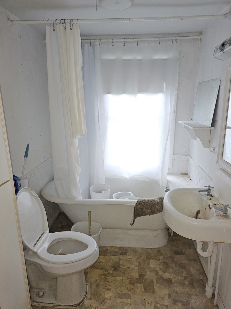 23018 Freeport Road Sterling, IL 61081 - Photo 6 of 19 a bathroom with a sink and a mirror