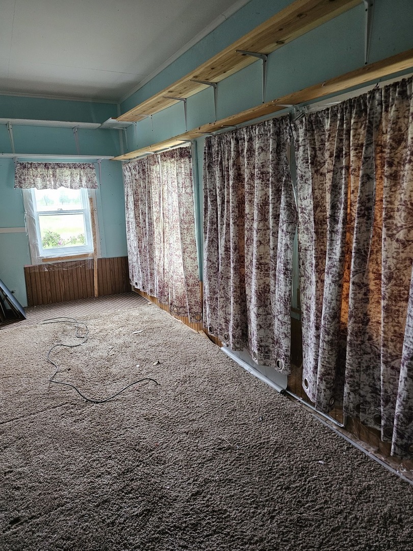 23018 Freeport Road Sterling, IL 61081 - Photo 8 of 19 a view of an empty room with a window