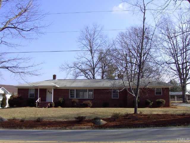 254 Winhaven Street Roxboro, NC 27573 - Photo 1 of 1 a front view of a building with garden
