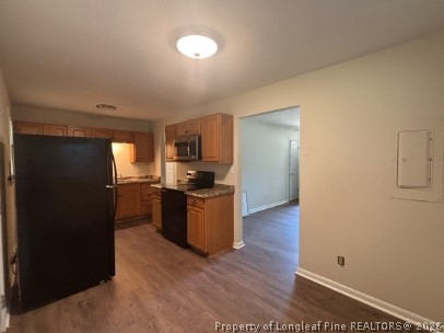 1070 Rulnick Street Fayetteville, NC 28304 - Photo 7 of 15 a kitchen with a refrigerator and a stove top oven