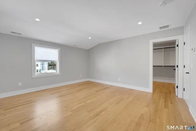 a bathroom with a toilet sink and shower