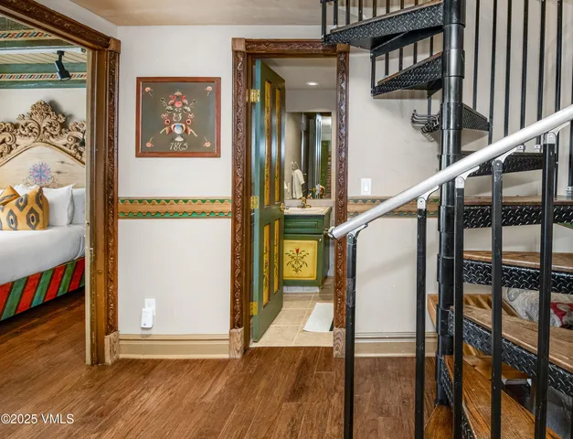 a view of an entryway with wooden floor