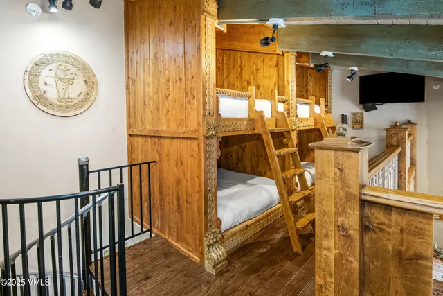 a view of a livingroom with furniture and a flat screen tv