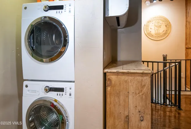 a view of storage and utility room with washer and dryer