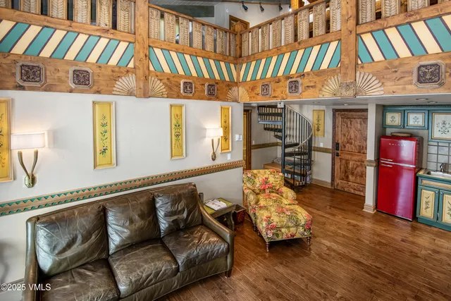 a outdoor living area with furniture and wooden floor