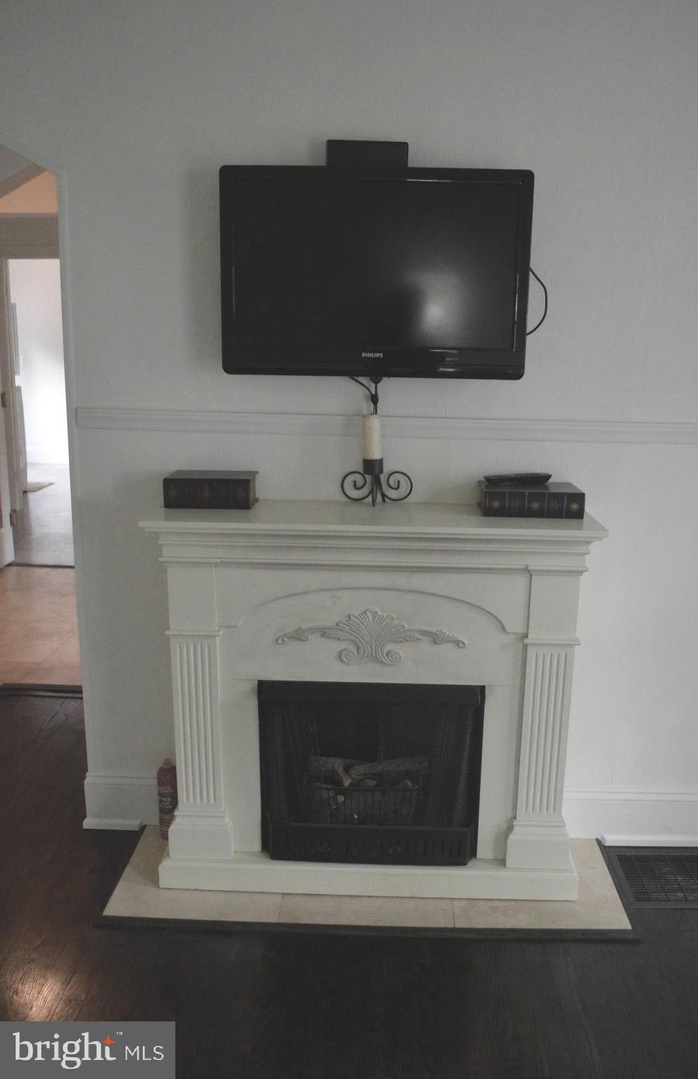 6708 Woodland Road Morningside, MD 20746 - Photo 18 of 42 Television above fireplace