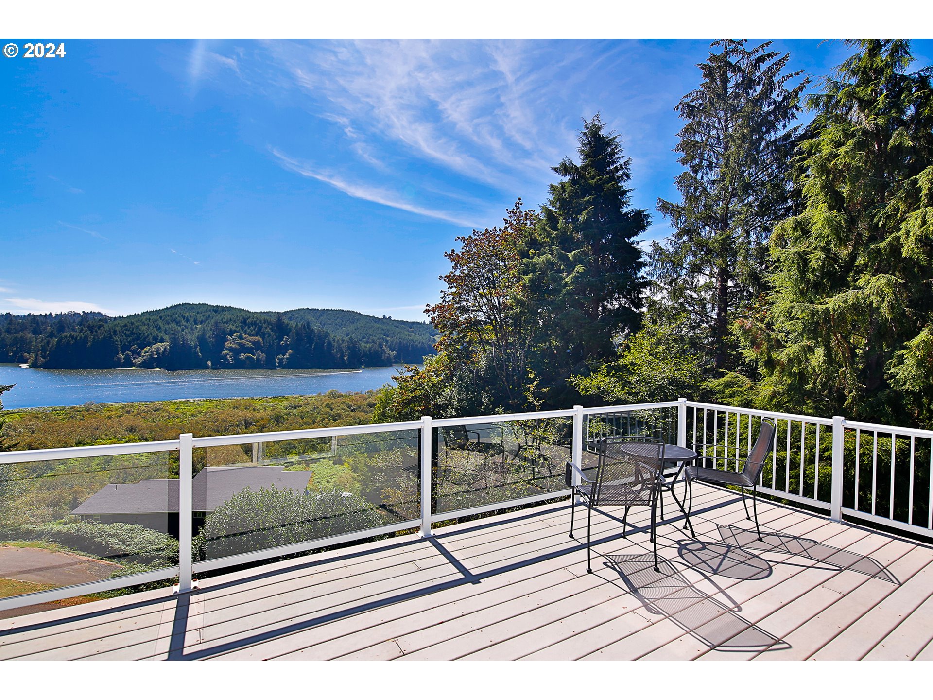 311 Council Hill Road Lakeside, OR 97449 - Photo 11 of 42 a view of a roof deck with couches and wooden floor