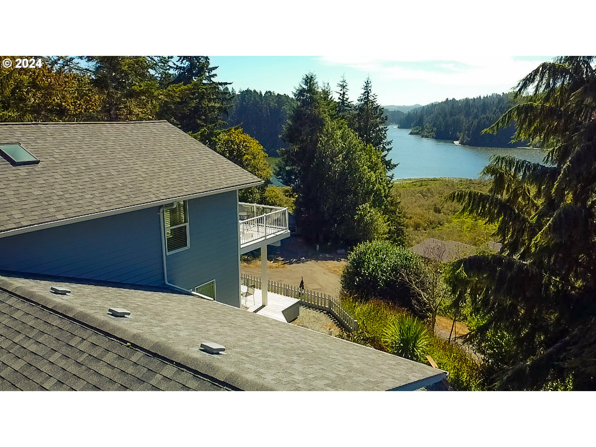 311 Council Hill Road Lakeside, OR 97449 - Photo 14 of 42 a view of a house with a yard