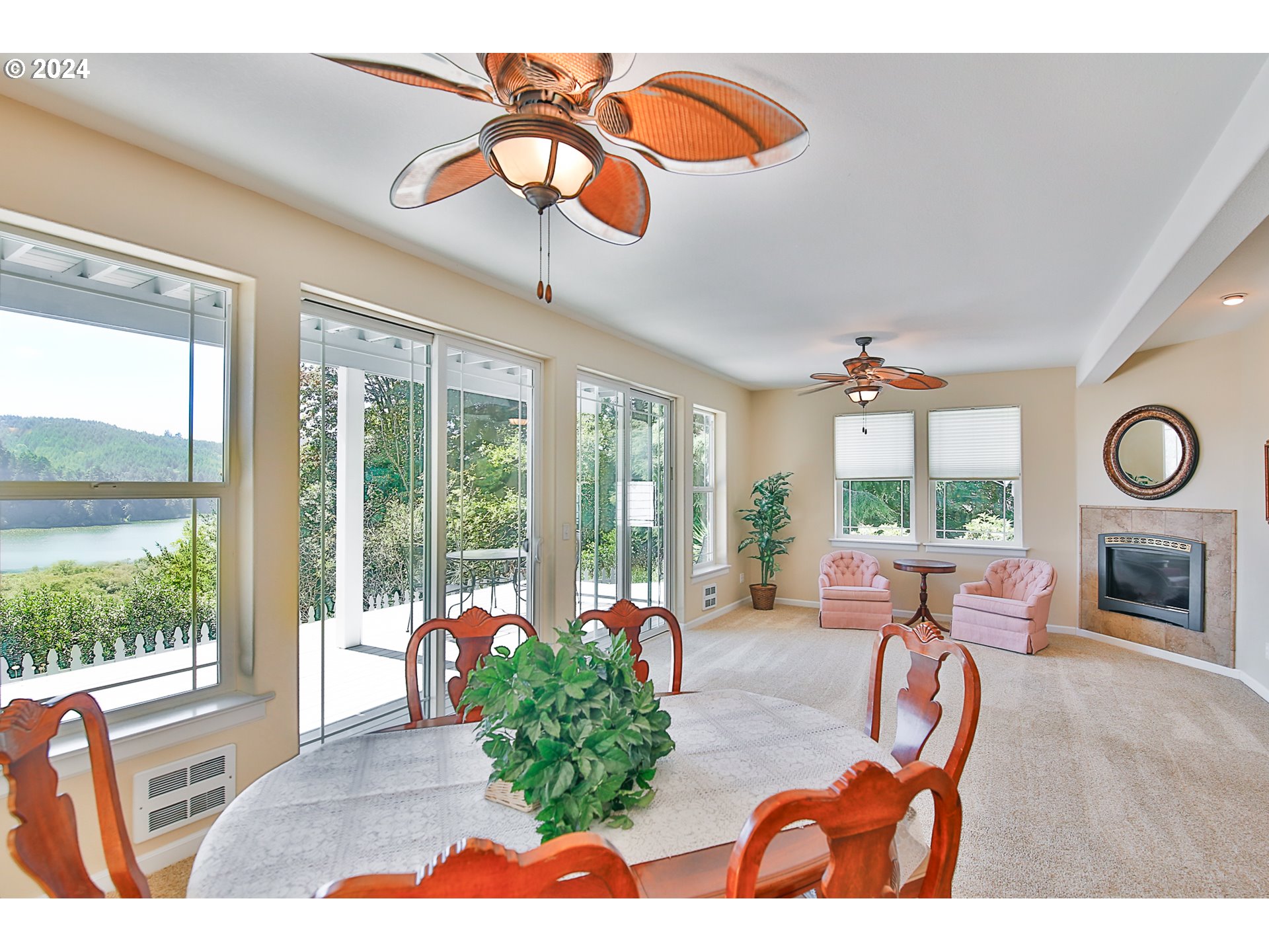 311 Council Hill Road Lakeside, OR 97449 - Photo 20 of 42 a living room with fireplace furniture and a large window