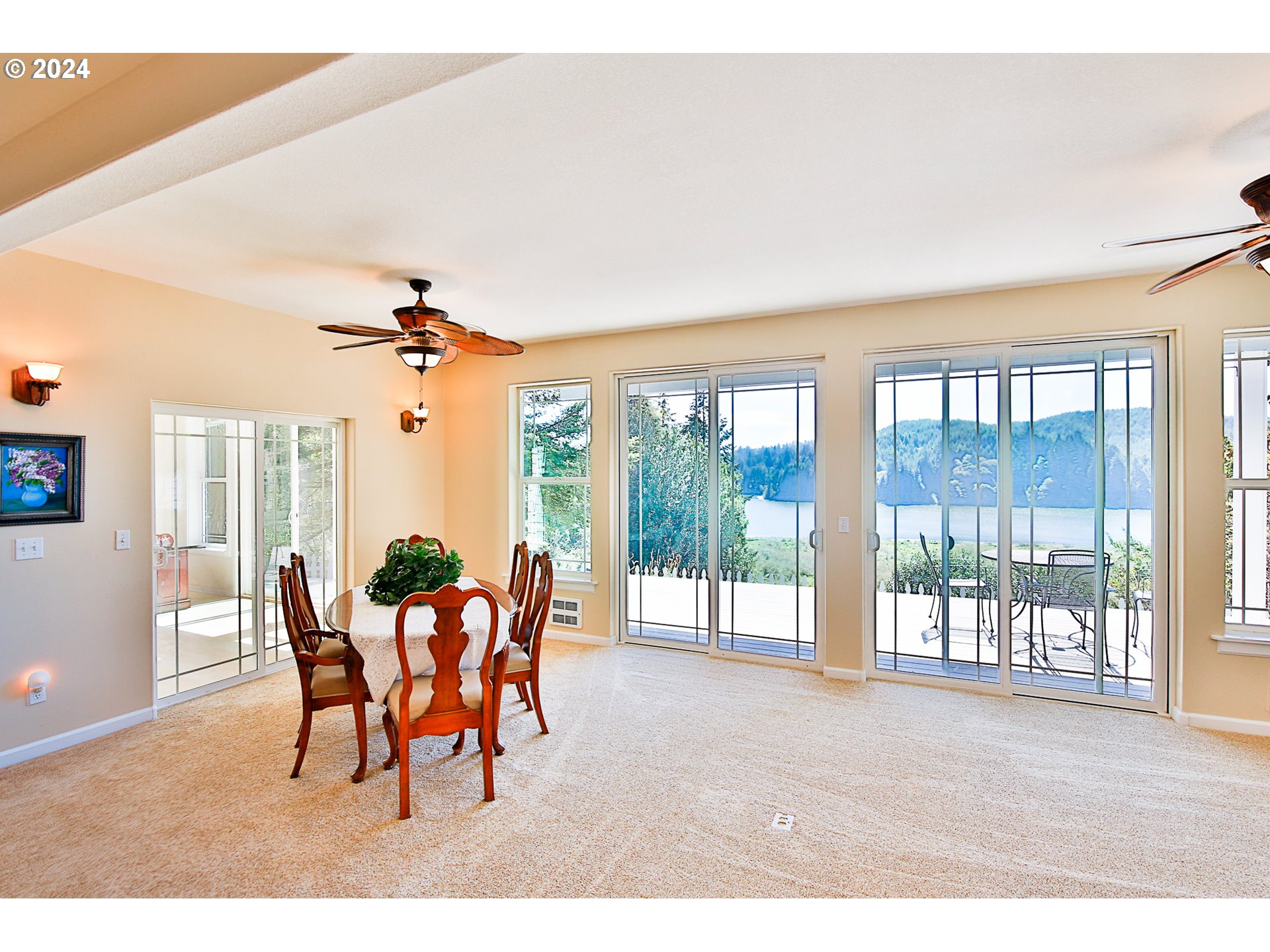 311 Council Hill Road Lakeside, OR 97449 - Photo 29 of 42 a dining room with furniture and a large window