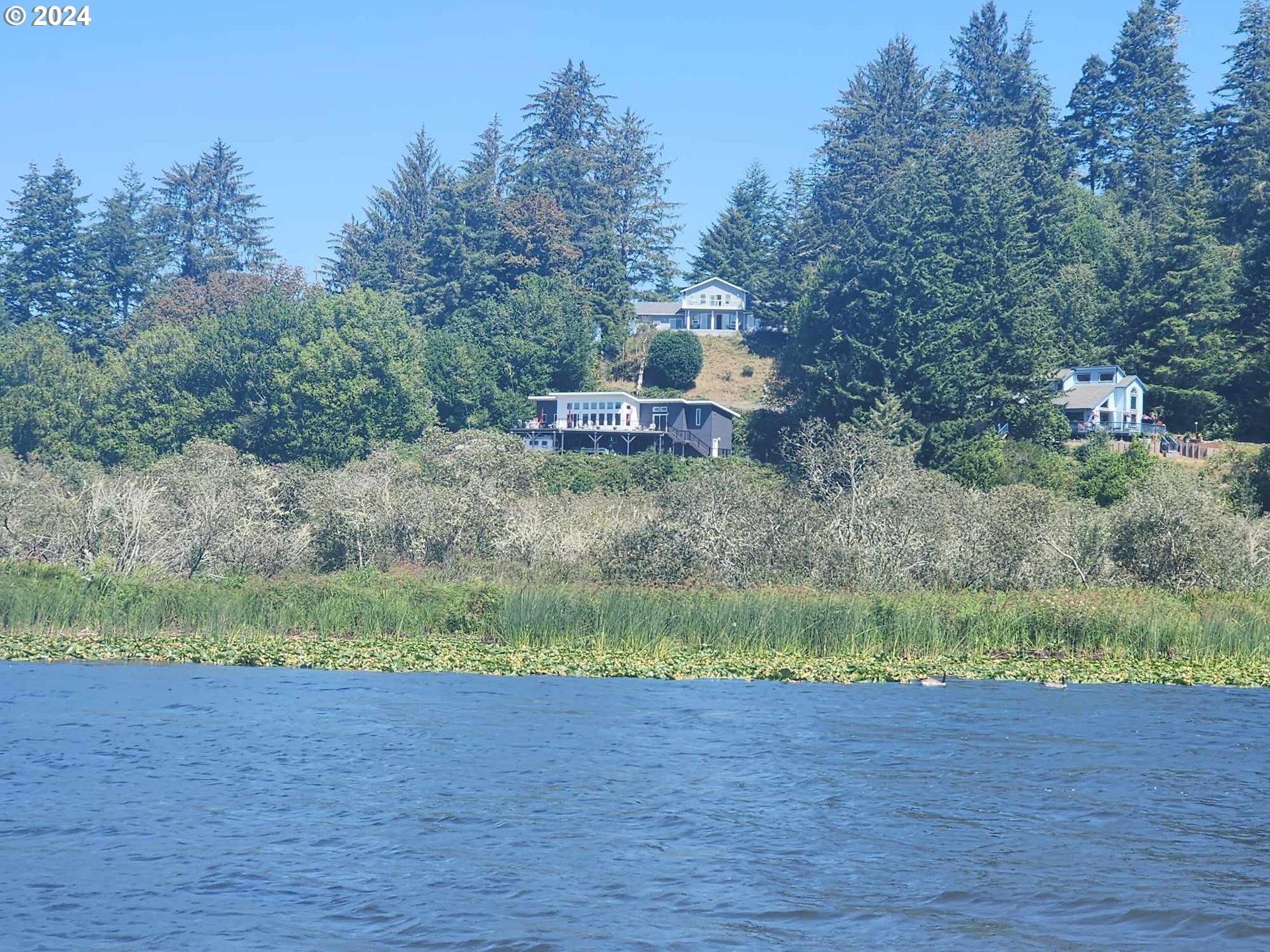 311 Council Hill Road Lakeside, OR 97449 - Photo 31 of 42 a front view of a house with a yard