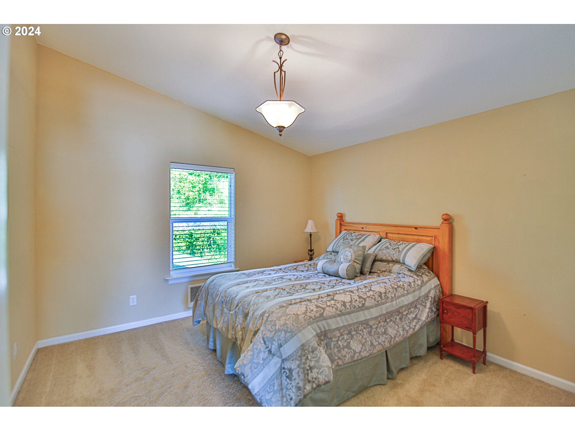 311 Council Hill Road Lakeside, OR 97449 - Photo 33 of 42 a bedroom with a bed and a window