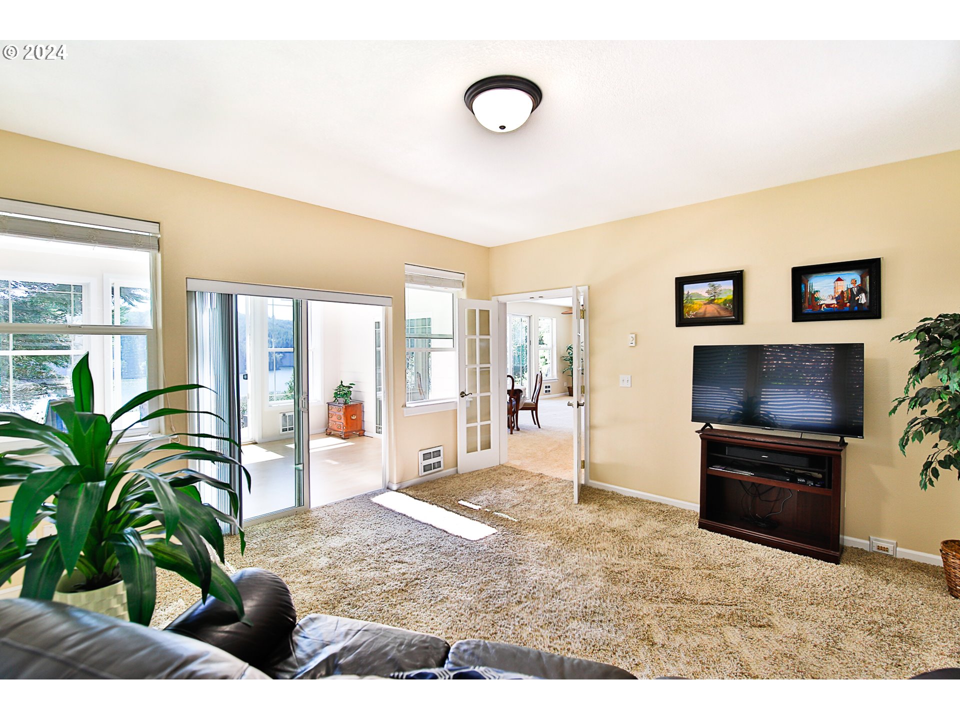 311 Council Hill Road Lakeside, OR 97449 - Photo 42 of 42 a living room with furniture and a flat screen tv