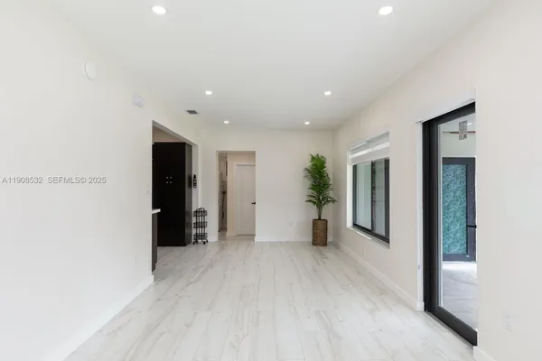 a view of an empty room with a window