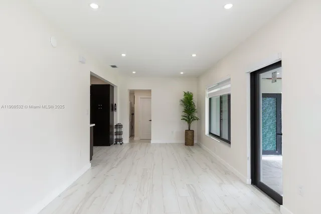 a view of an empty room with a window