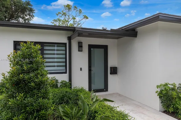 a view of a house with a garage