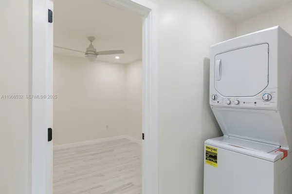 a view of a storage & utility room with a washer dryer