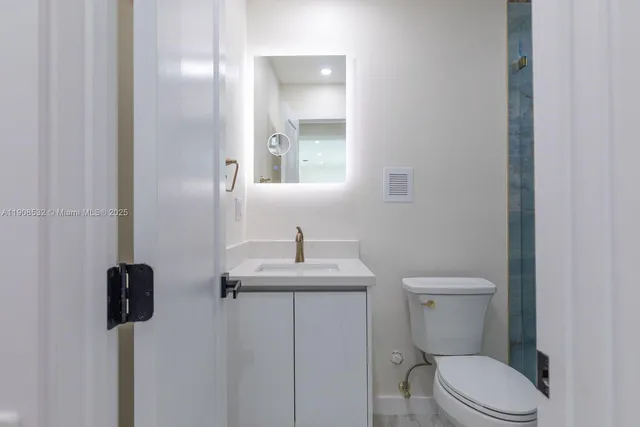 a bathroom with a toilet and a sink