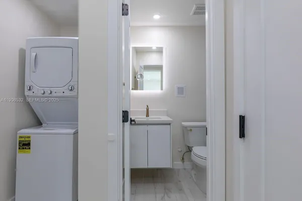 a bathroom with a toilet and a sink