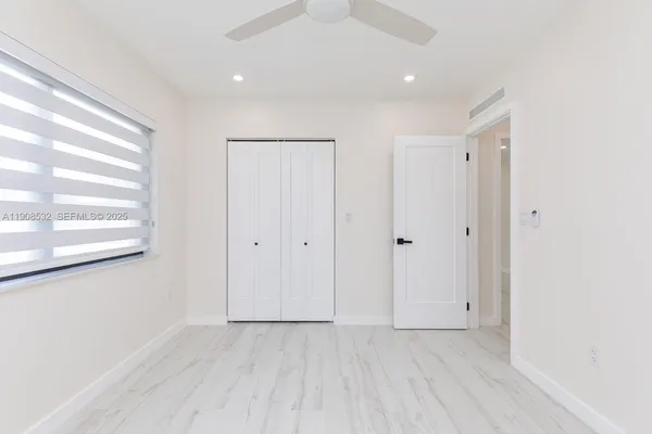 a view of an empty room with a window