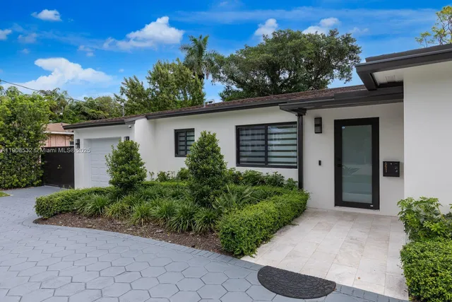 a house that has a lot of plants in it