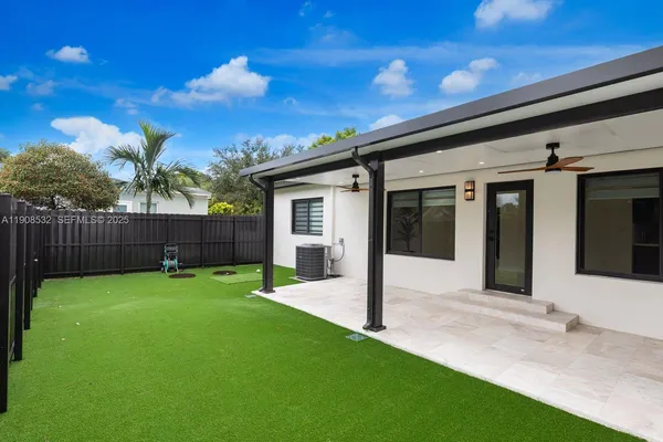 a view of an house with backyard porch and entertaining space