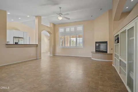 an empty room with windows and entrance
