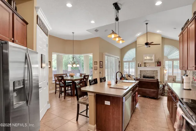 a living room with furniture a fireplace and window