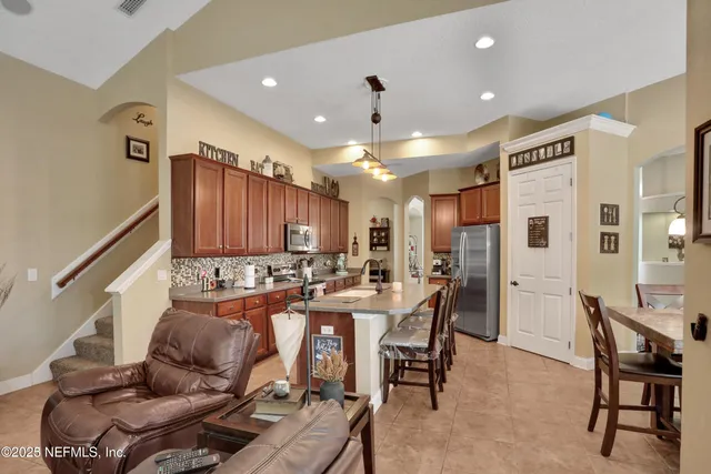 a view of walk in closet with clothes