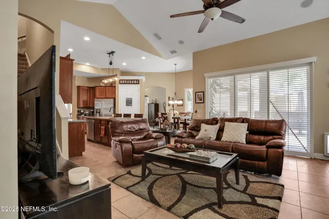 a view of walk in closet with clothes