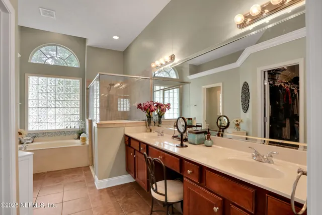 a view of an entryway with wooden floor and livingroom