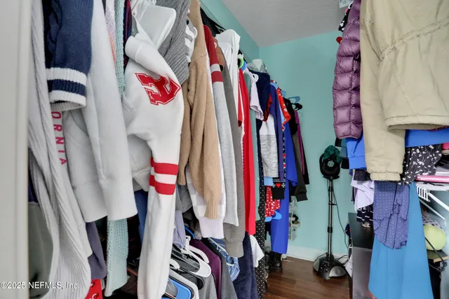 a view of backyard of house with green space
