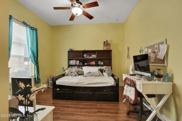 a view of a park with large trees