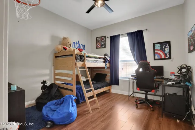 an aerial view of residential houses with outdoor space and street view