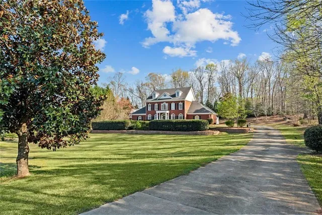 a front view of a house with a yard