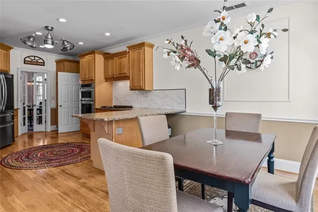 a living room with furniture and a ceiling fan