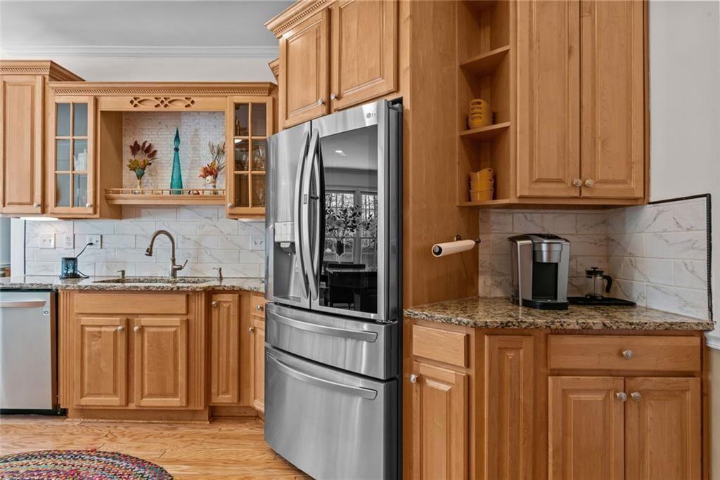 168 Jersey Road Oxford, GA 30054 - Photo 26 of 59 a kitchen with stainless steel appliances granite countertop a refrigerator and a sink
