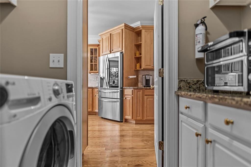 168 Jersey Road Oxford, GA 30054 - Photo 29 of 59 a view of a kitchen with washer and dryer