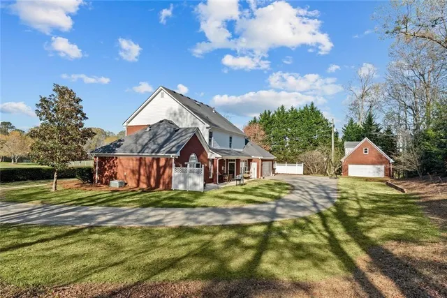 a view of a house with a big yard