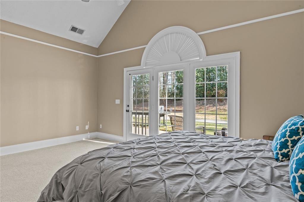 168 Jersey Road Oxford, GA 30054 - Photo 35 of 59 a bedroom with a bed and a window