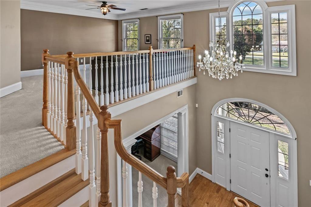 168 Jersey Road Oxford, GA 30054 - Photo 38 of 59 a view of a hallway with wooden floor and staircase